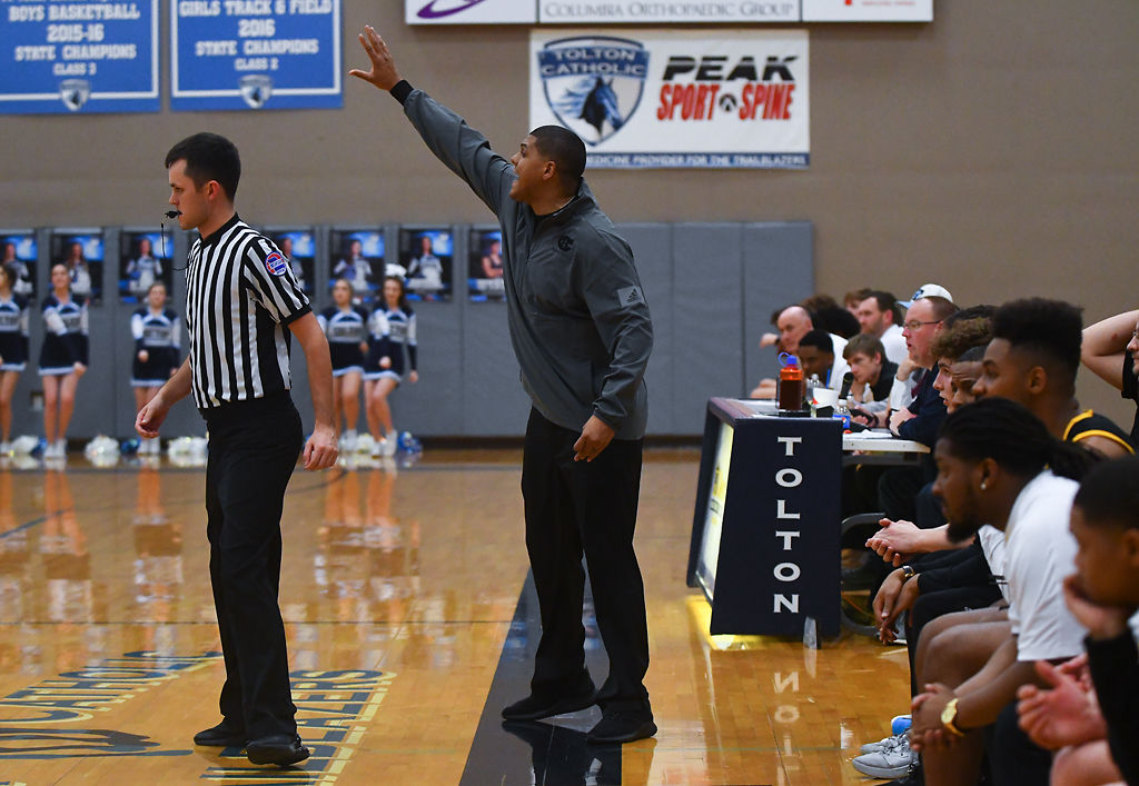 Hickman Head Coach Cray Logan yells at his team
